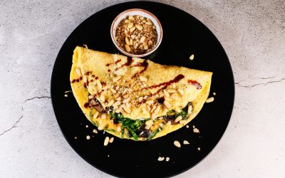 An omelette with spring greens and mushrooms